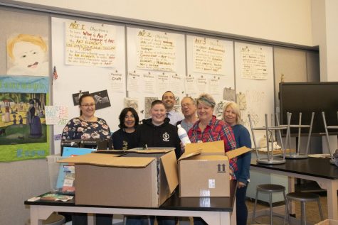 Principal Crombie and the WHS art department accepting an art donation from alumna Lisa Pellechia. Pellechia donated the supplies in honor of former student Katherine Adelstein.